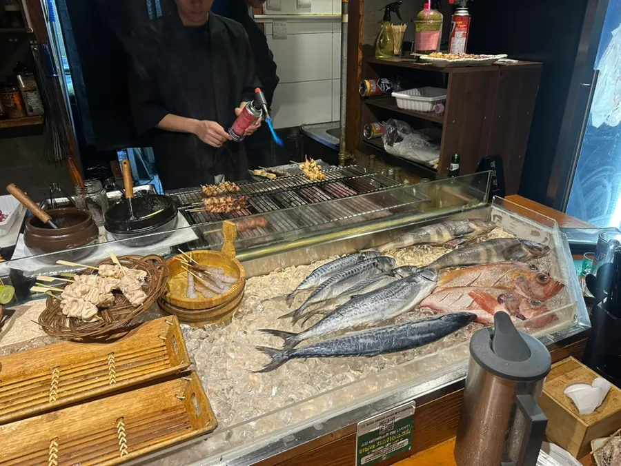 A plate of skewers infused with charcoal aroma