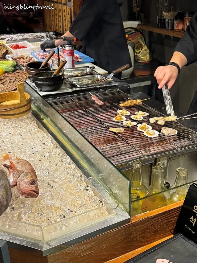 The robatayaki cooking area where skewers are grilled
