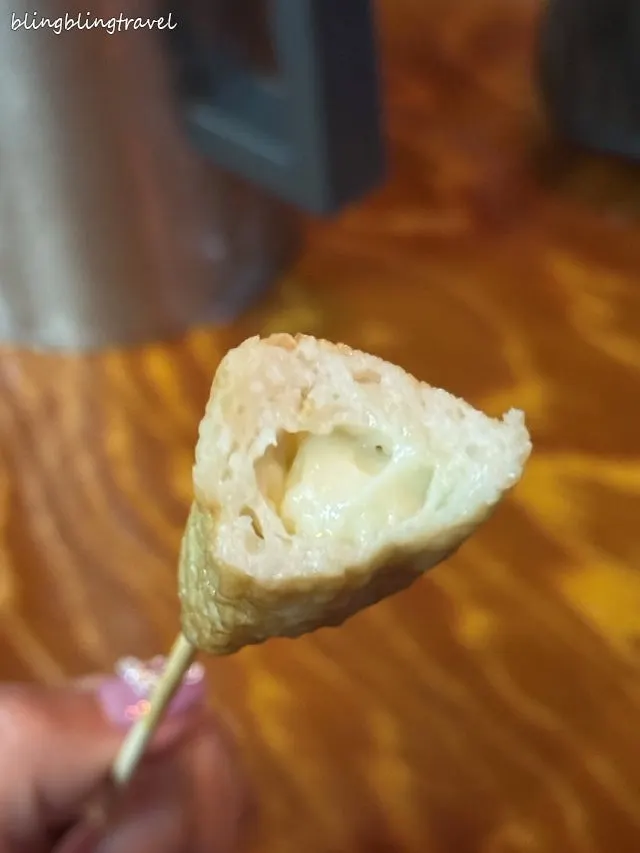 A pot generously filled with fish cake skewers