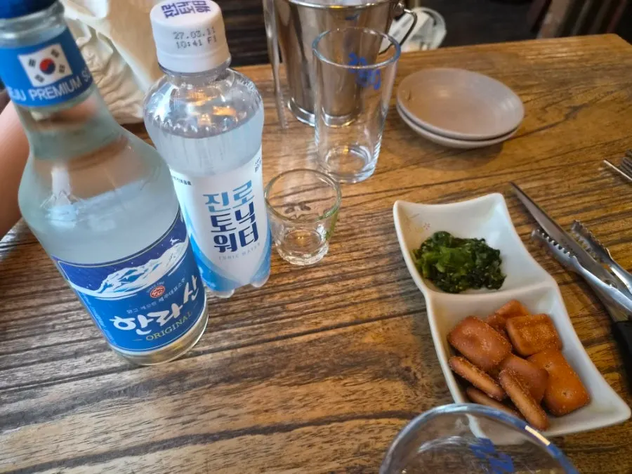 Hallasan soju and tonic water with an ice basket