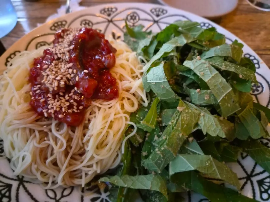 Perilla oil pasta topped with perilla leaves and salted octopus