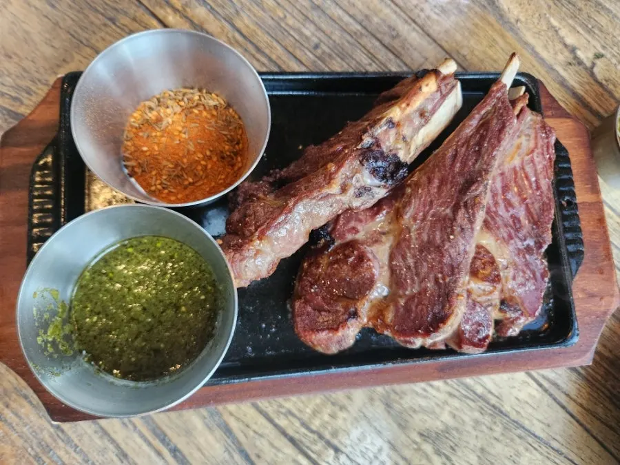Close-up of the lamb shoulder rack on the hot plate