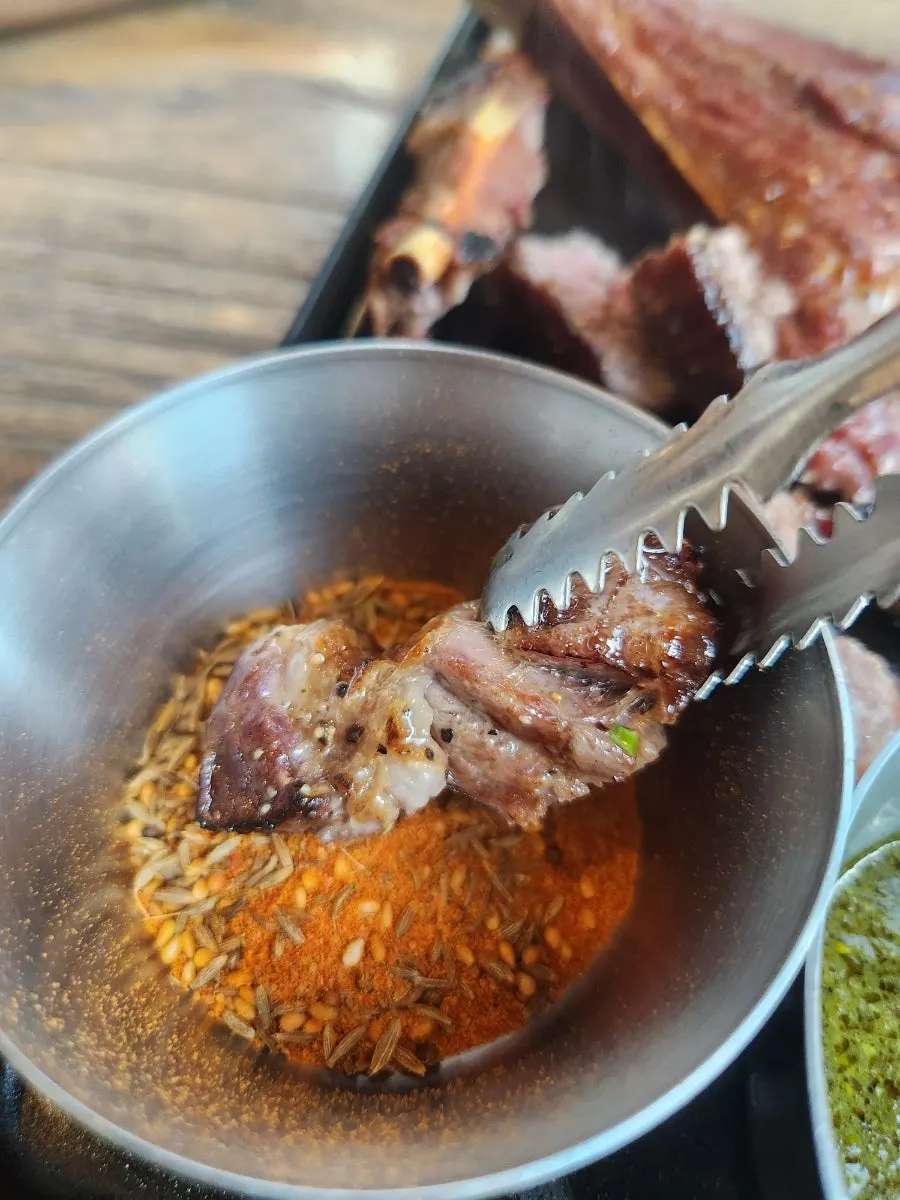 A piece of lamb dipped in zeera