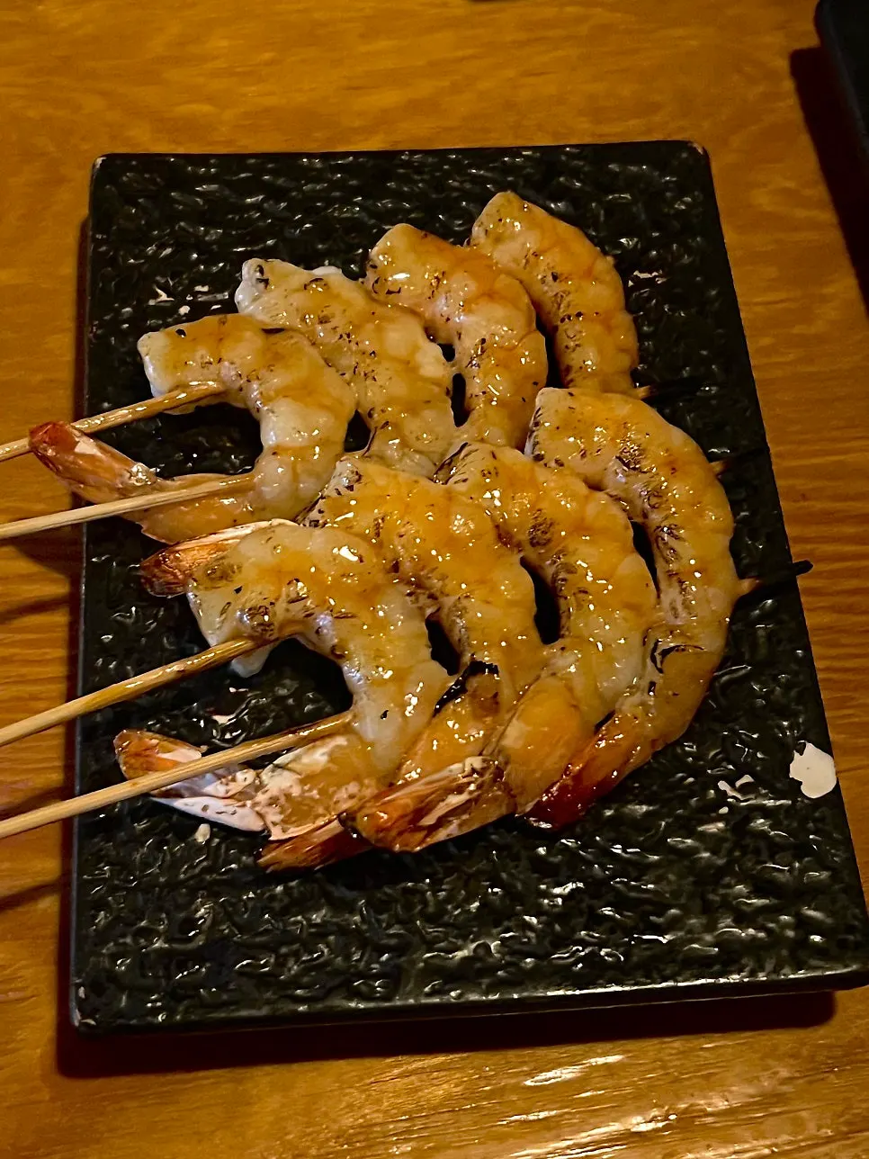A plate of buttery grilled shrimp