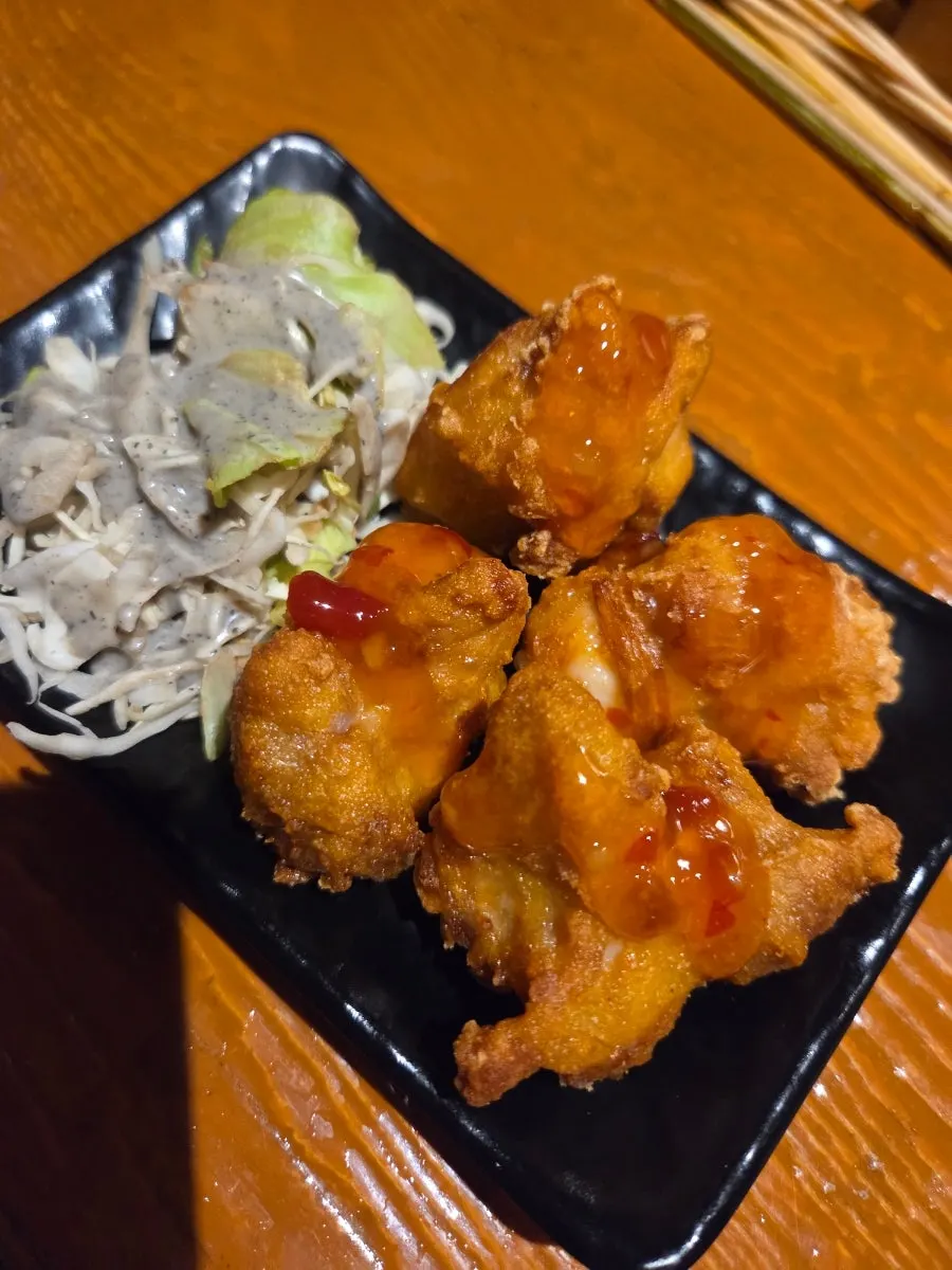 Salad served alongside the mini fritters