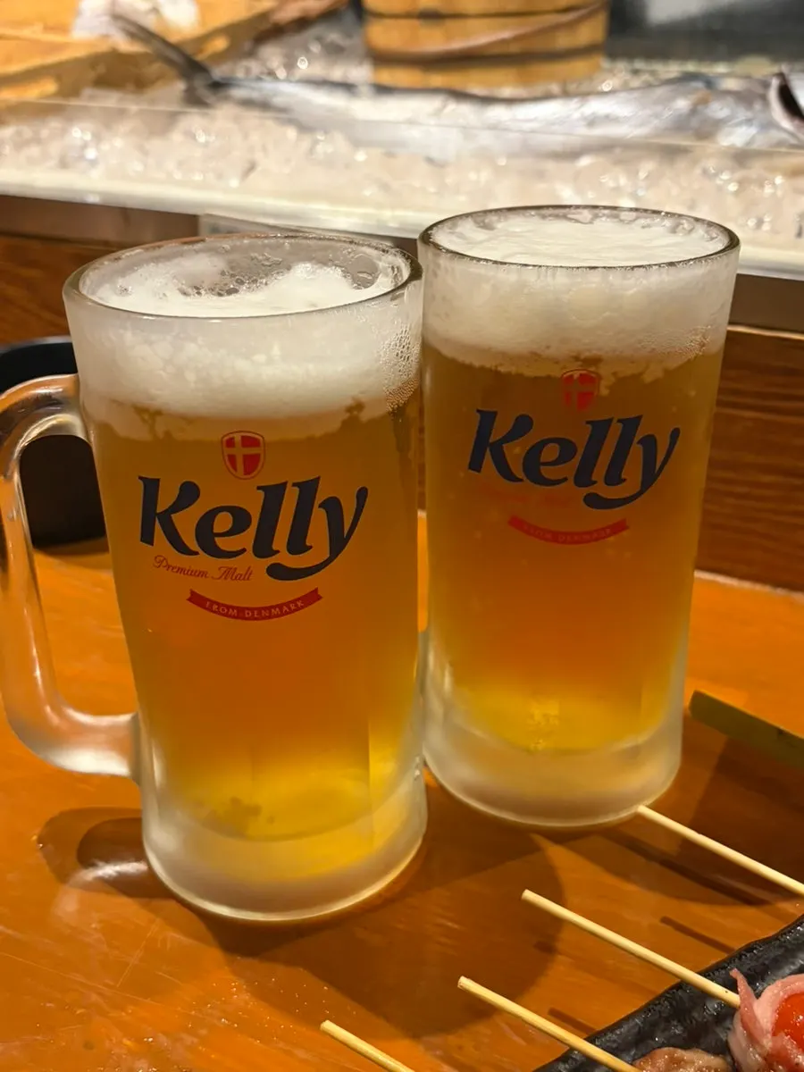 Draft beer and basic side dish on the table