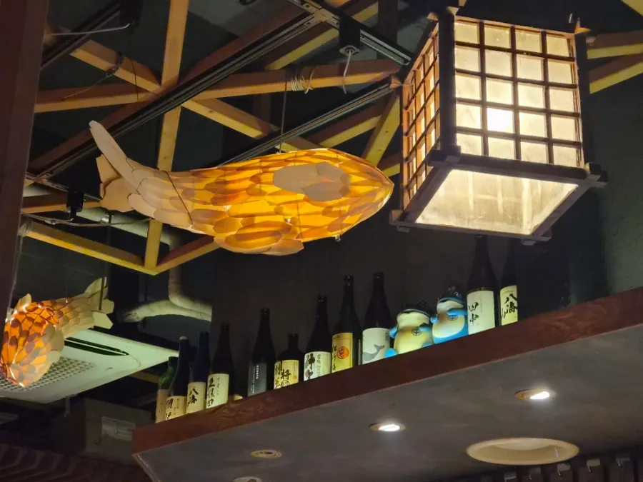 Izakaya interior beside the skewer-grilling counter