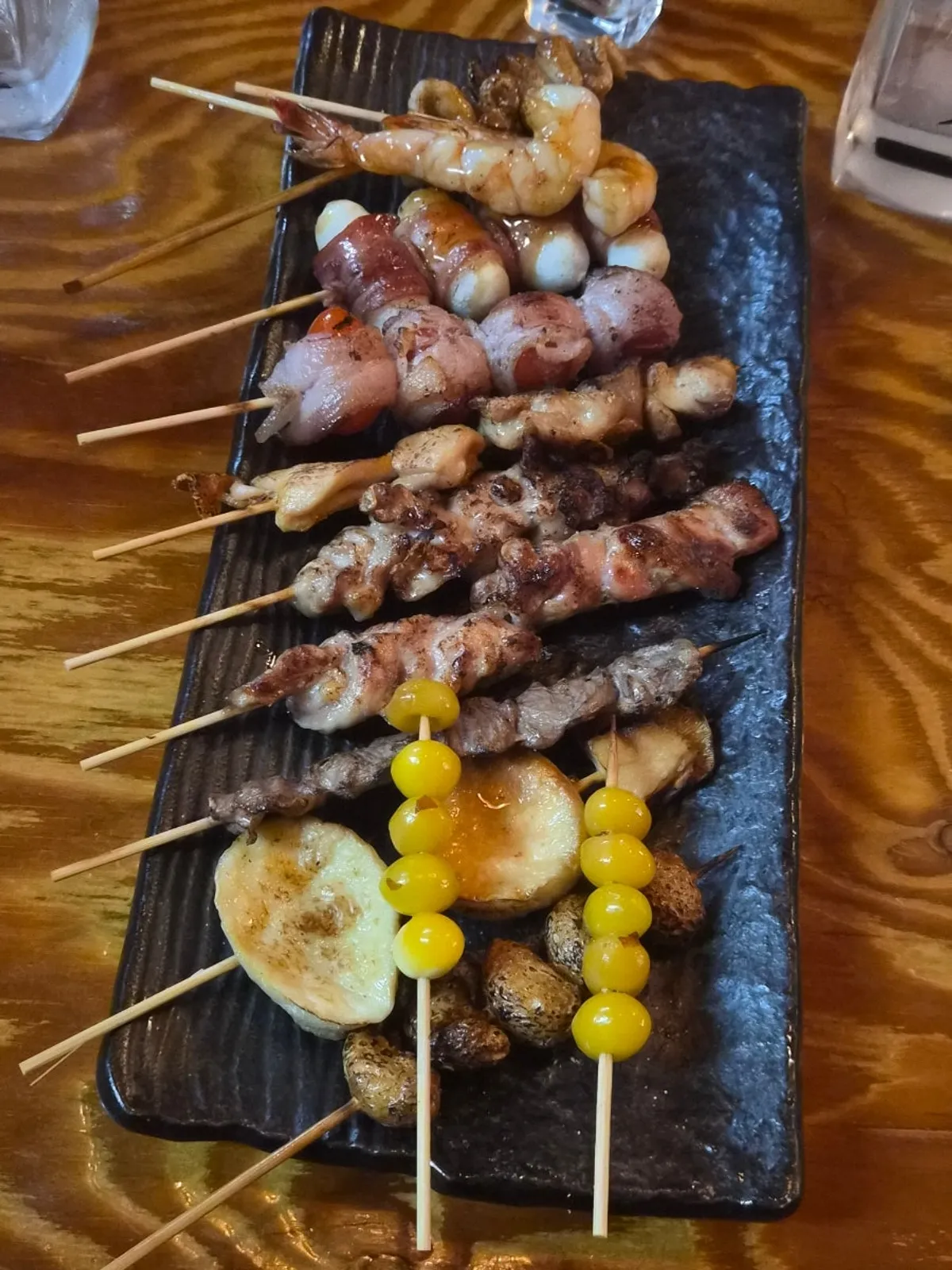 A full spread of assorted skewers, 11 kinds and 13 pieces