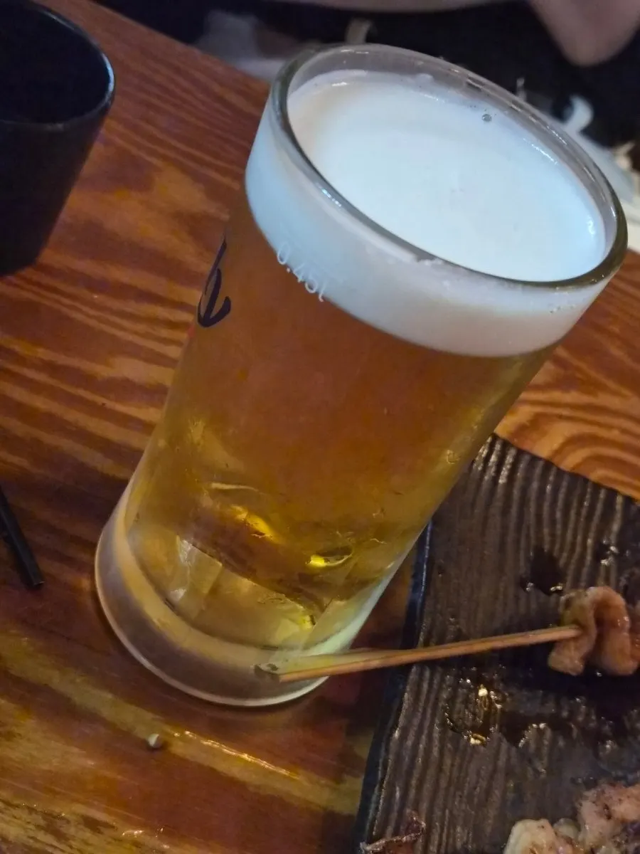 The drinking session continues at the izakaya table