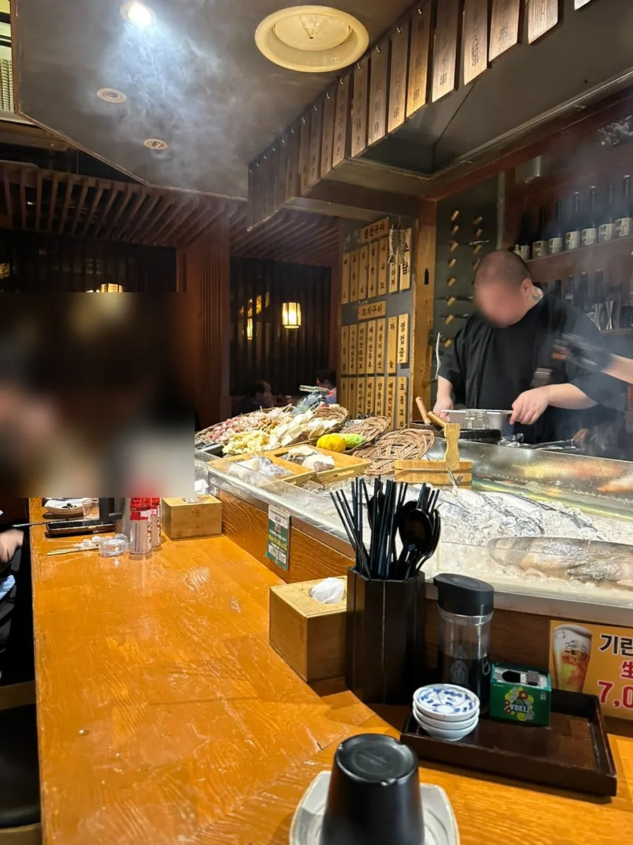 Interior of the restaurant, with a Japanese pub feel
