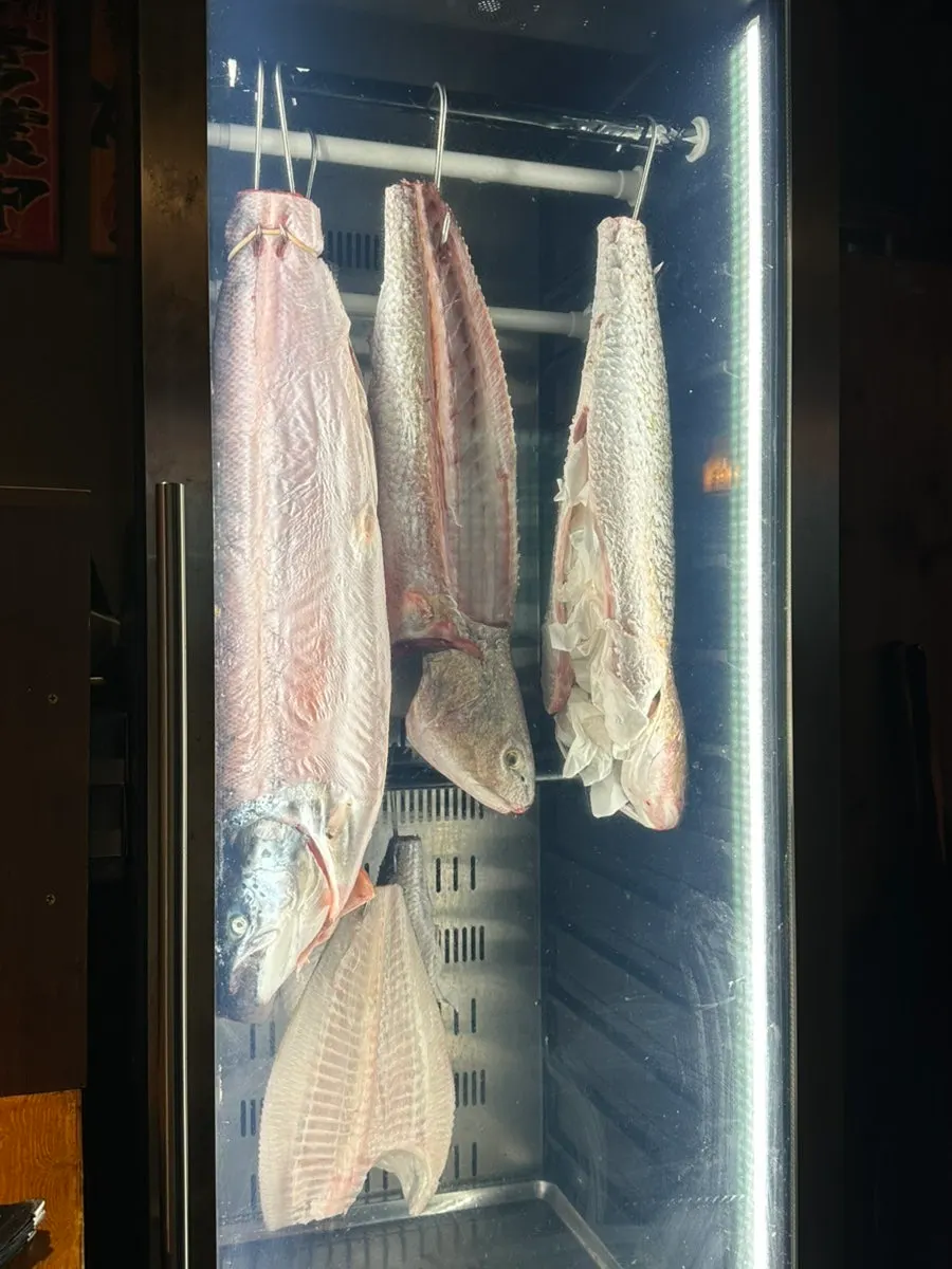 View of the cooking counter from the counter seats