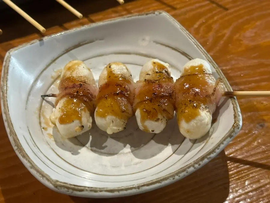 Bacon-wrapped cheese rice cake skewer from the assorted skewer platter