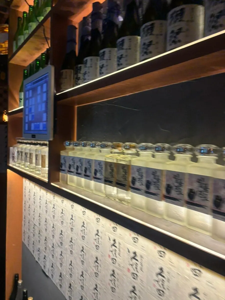 View of the charcoal grilling process from the bar table