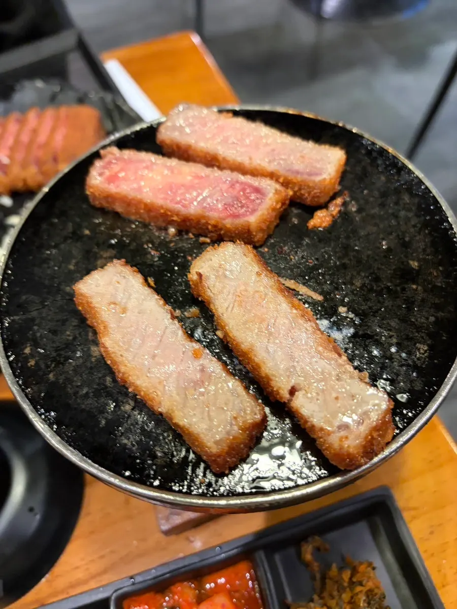 Cross-section of gyukatsu, crispy outside and moist inside