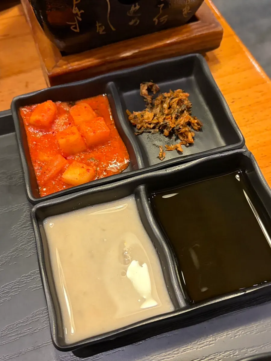 Salt and two sauces served alongside the gyukatsu