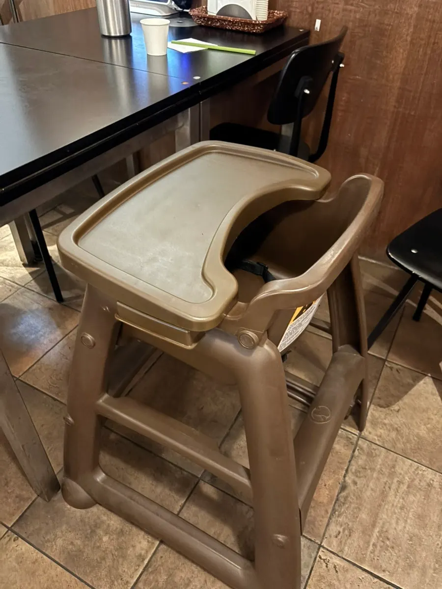 Baby sitting in a high chair