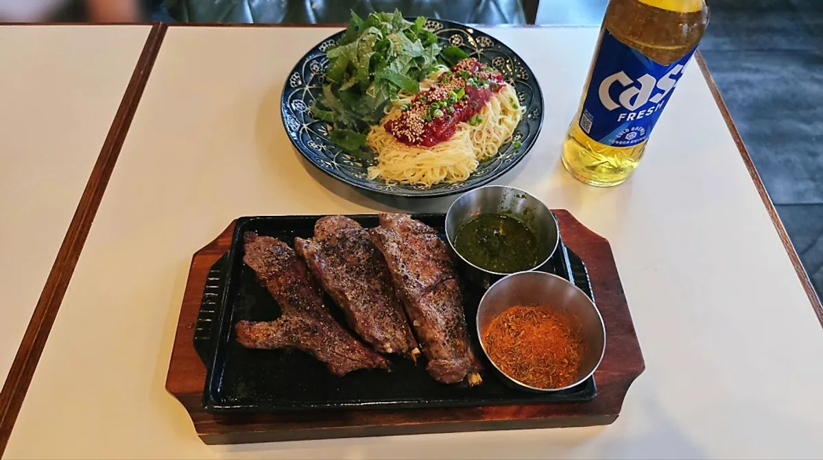 Whole lamb shoulder rack served before cutting