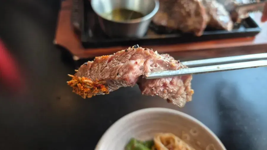 Juicy lamb shoulder rack cut with scissors
