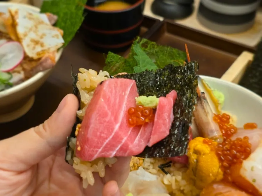 A thick piece of sashimi placed on rice