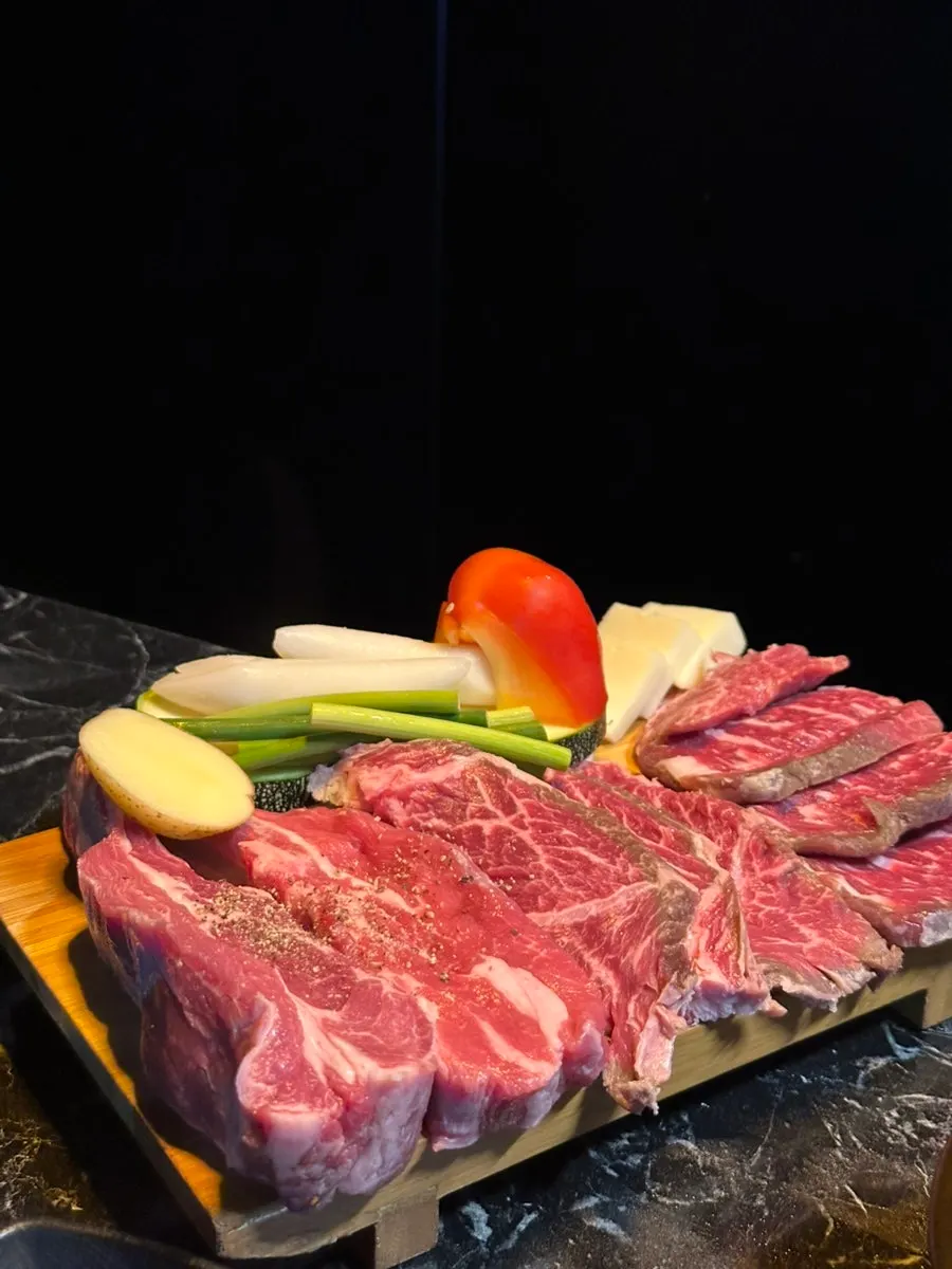 A platter of thick, densely marbled meat