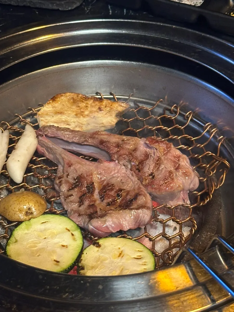Grilled meat with onions, mushrooms, and zucchini