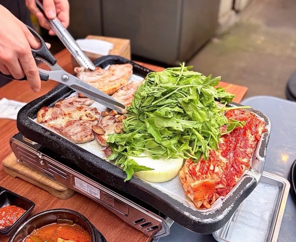 Patio table at Smile Samgyeop Main Branch set for a group dinner