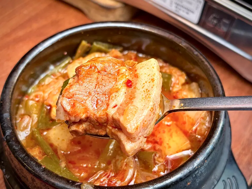 Complimentary kimchi jjigae served as standard