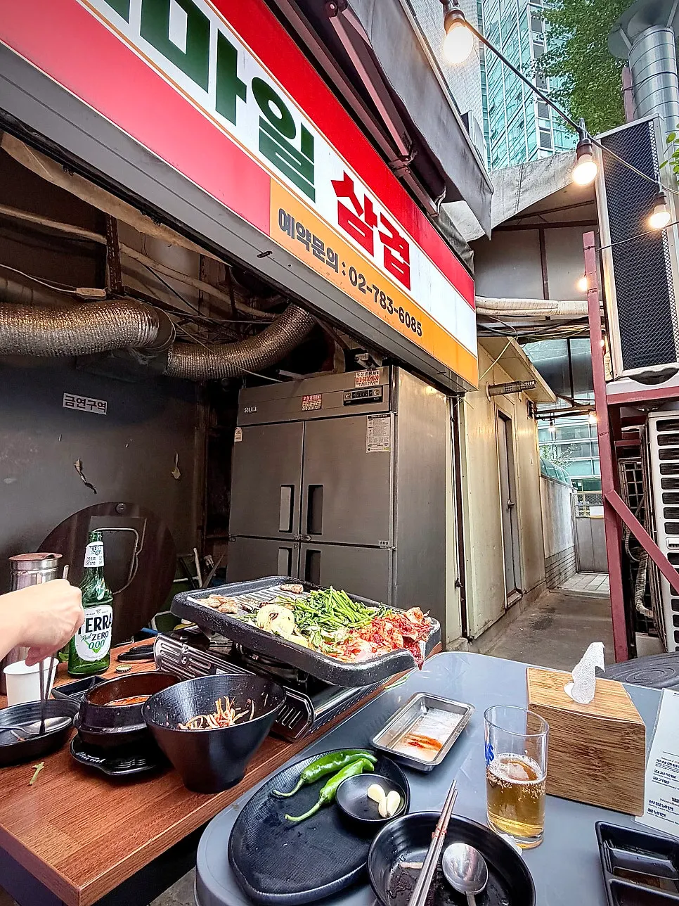 A bite of pork belly at the patio table
