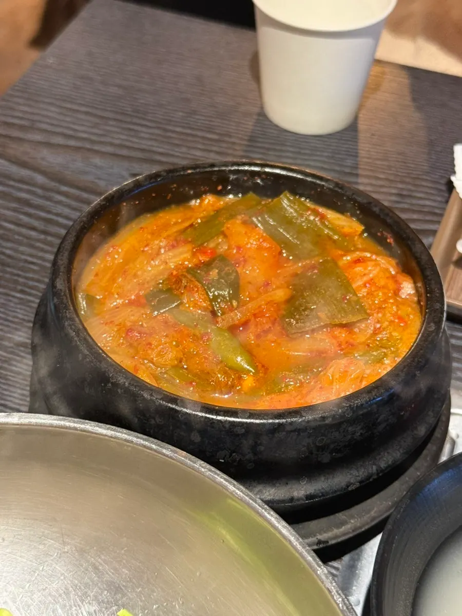 A bowl of complimentary kimchi jjigae