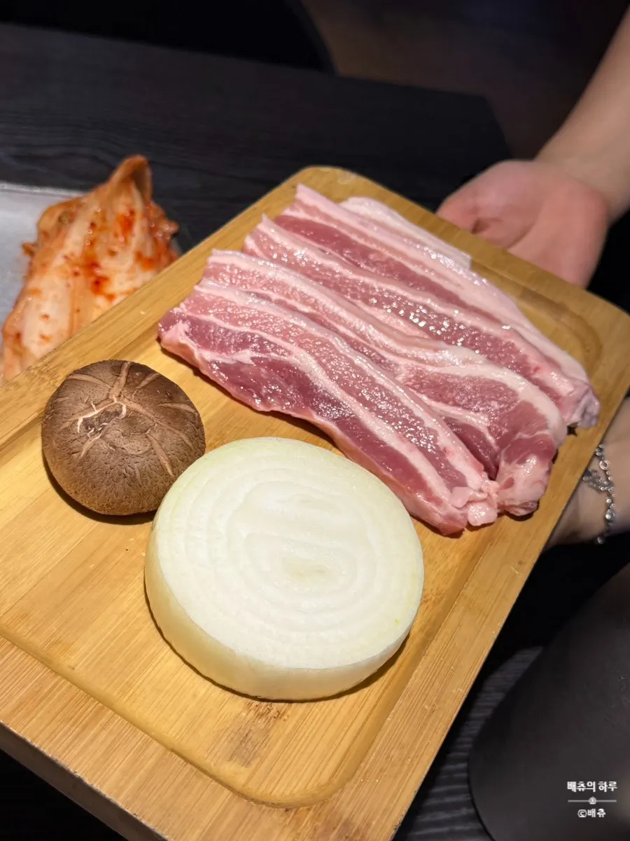Kimchi and pork belly placed on the grill