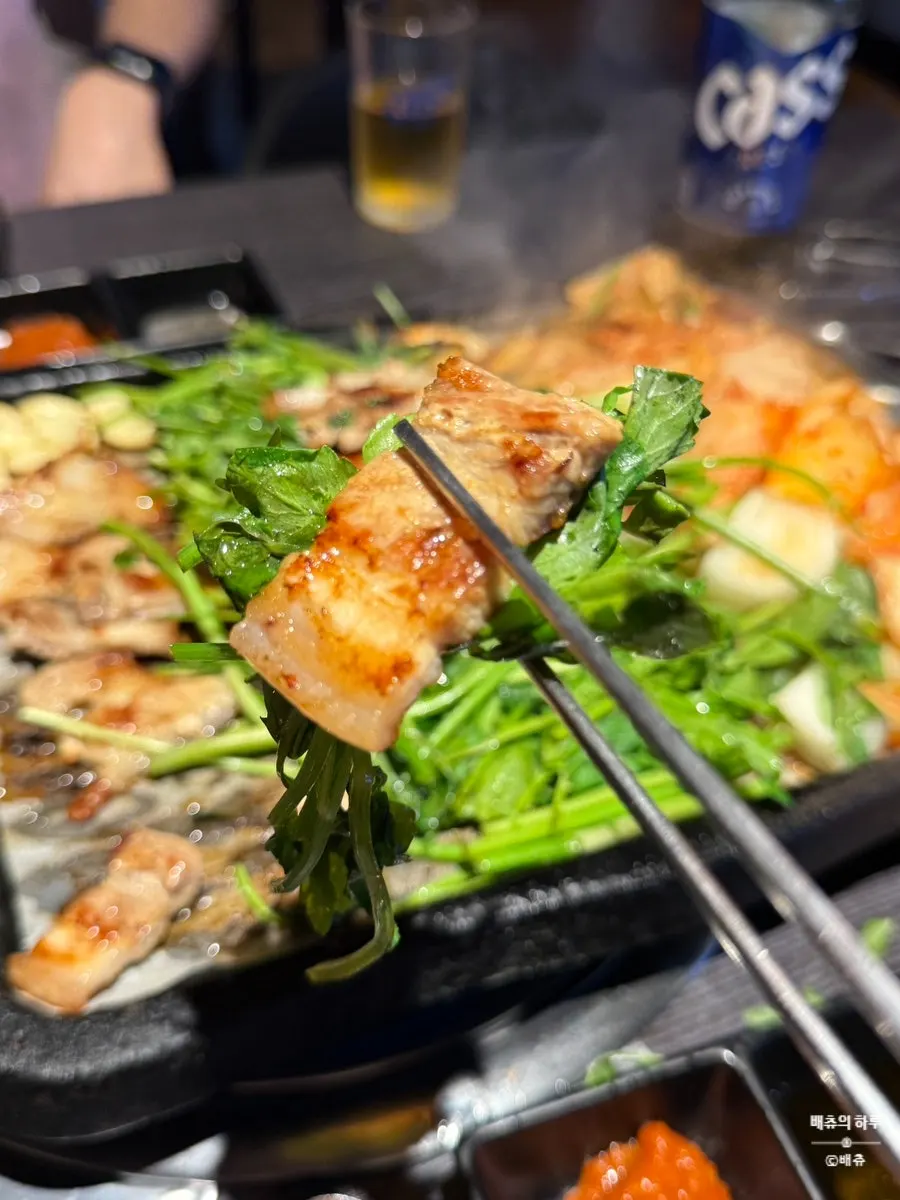 Grilled pork belly with a piece of minari