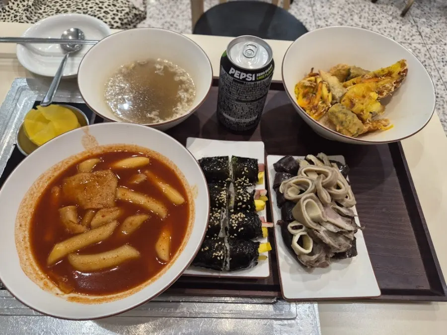 Combo set with tteokbokki, fried snacks, sundae, and gimbap
