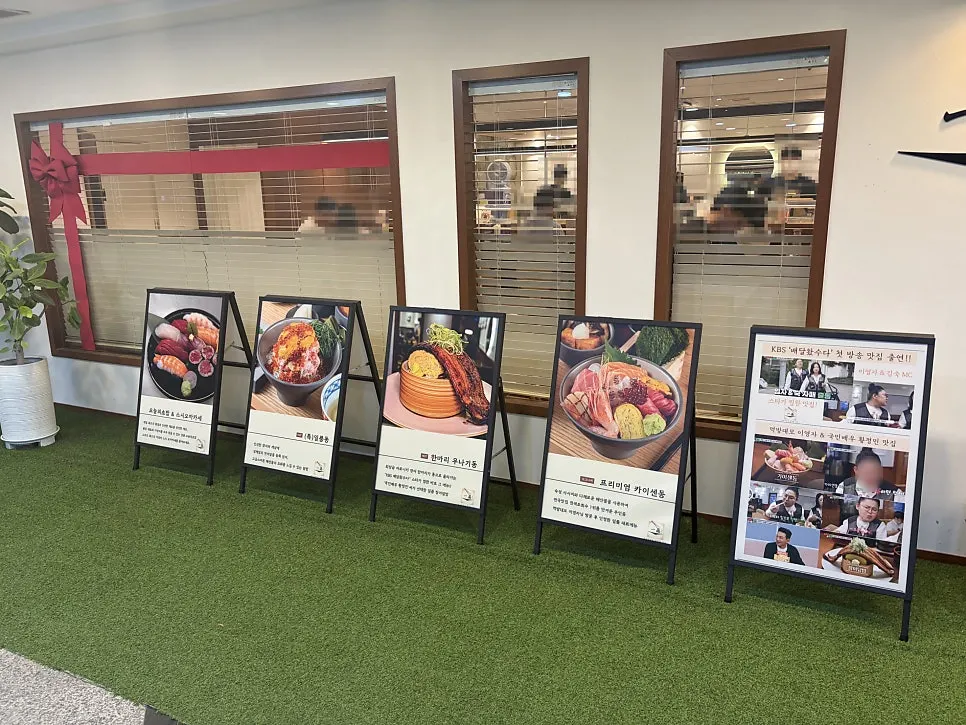 Standing signs for signature menu items in the hallway