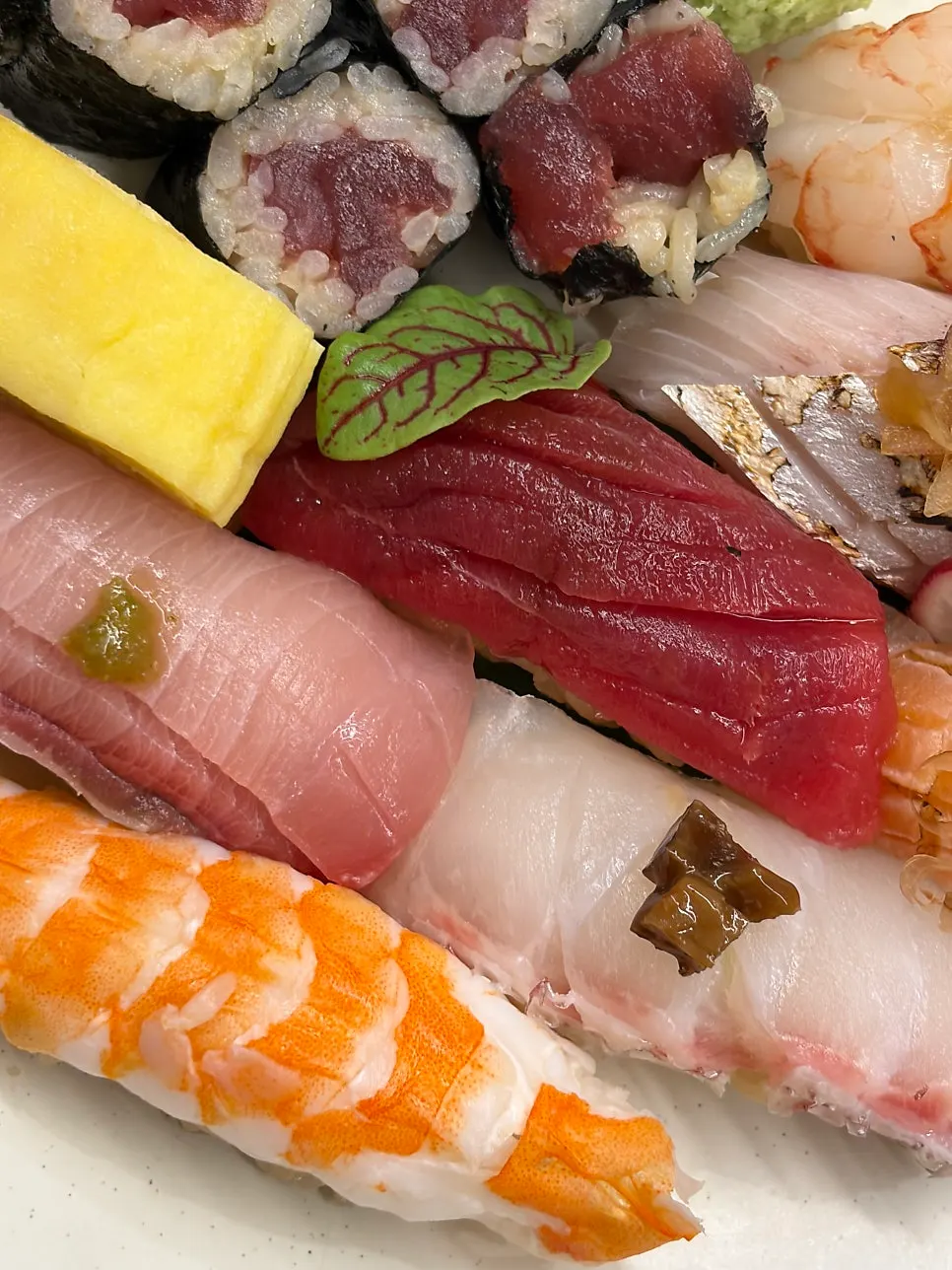 White fish sushi topped with shiitake wasabi