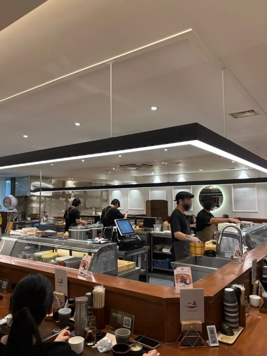 Spacious interior and bar seating at Ilpum Yeouido Branch