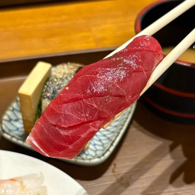 Close-up of sushi topped with thick raw fish