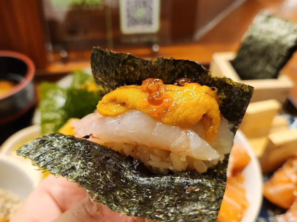 Bite-sized maki topped with sweet shrimp and sea urchin