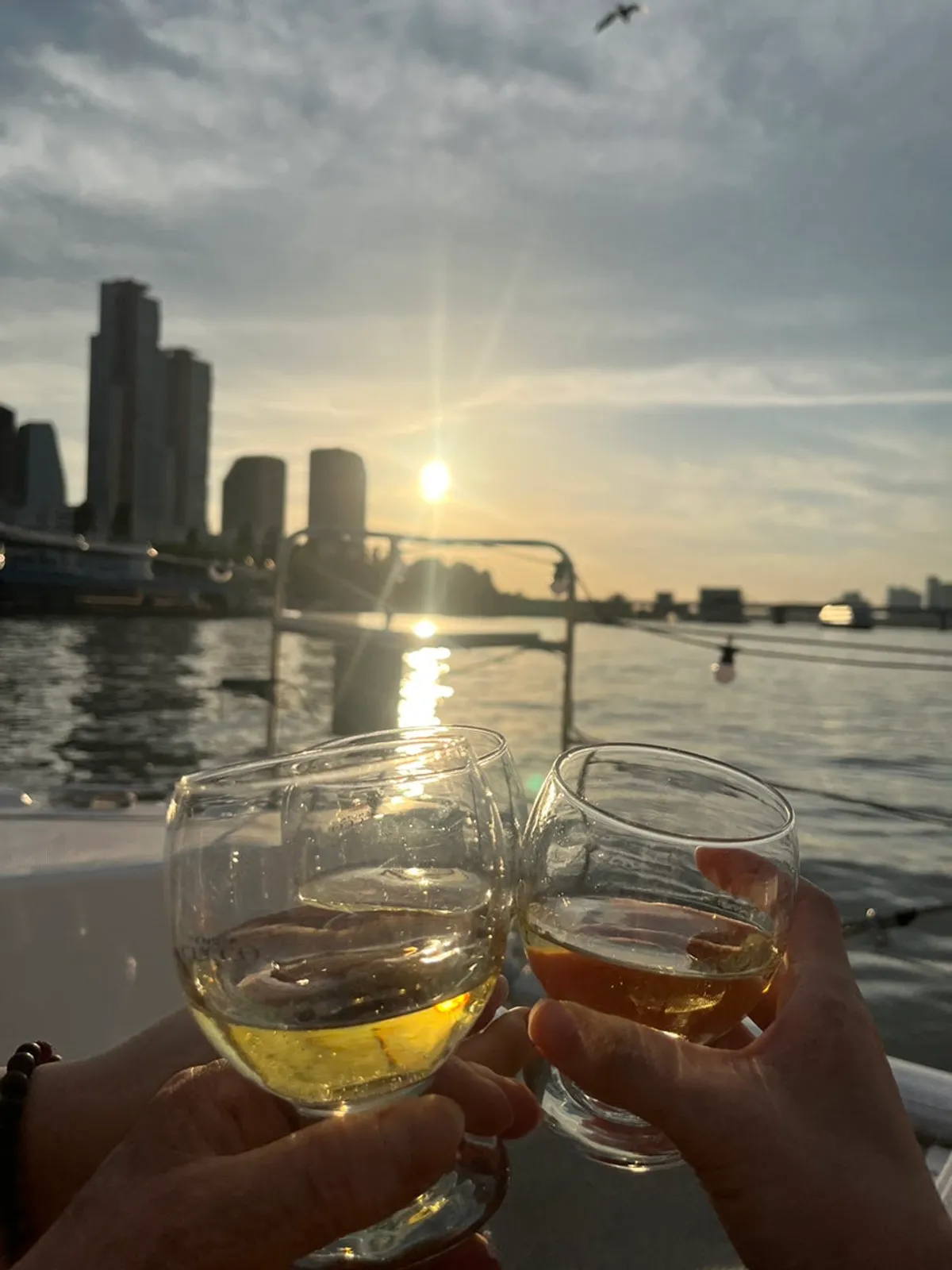 A Han River yacht ride looking toward buildings and a bridge