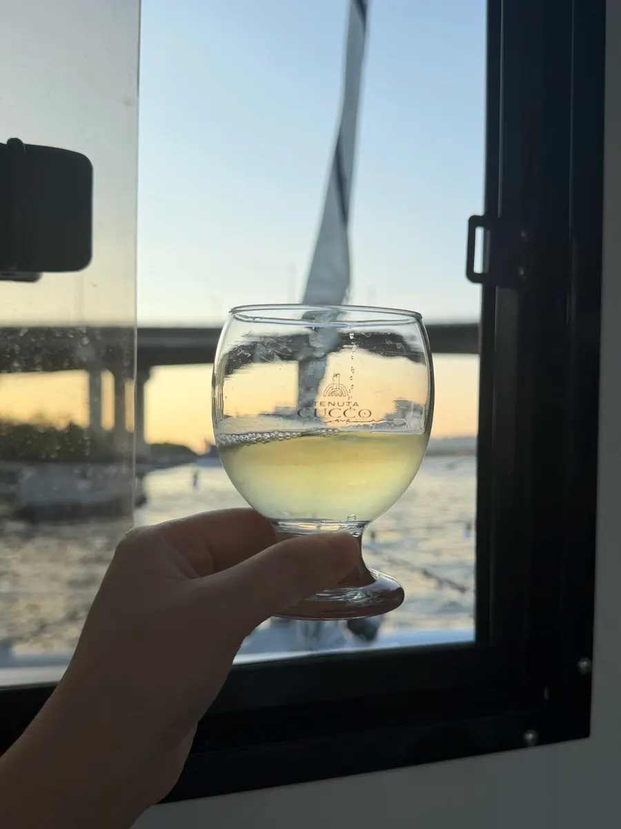 A glass of wine provided on the yacht tour