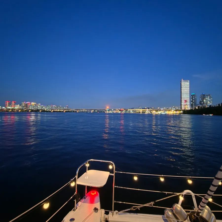 Yacht passing along the Han River in the evening