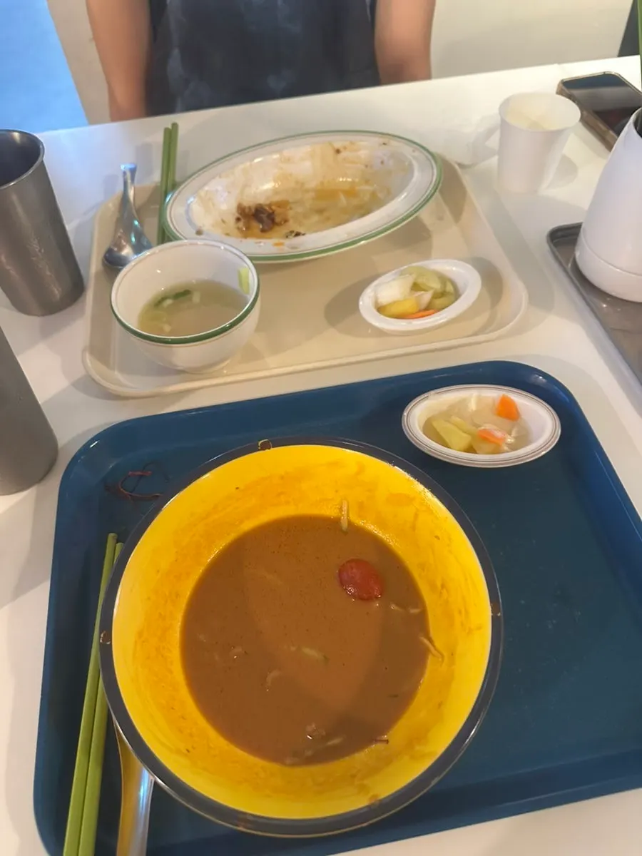 Empty bowls after finishing both dishes at Jeongyun Kitchen