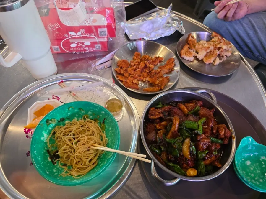 A spread of dakbokkeum with other market foods
