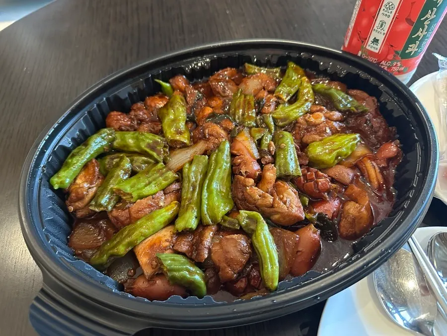 Shishito pepper picked up together with the chicken