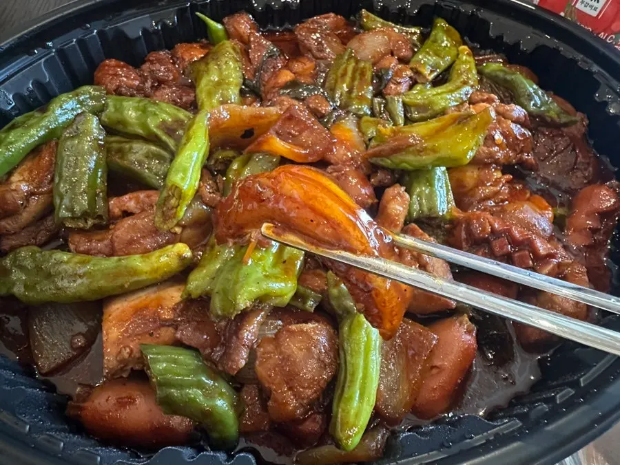 Eating shishito peppers together with the chicken