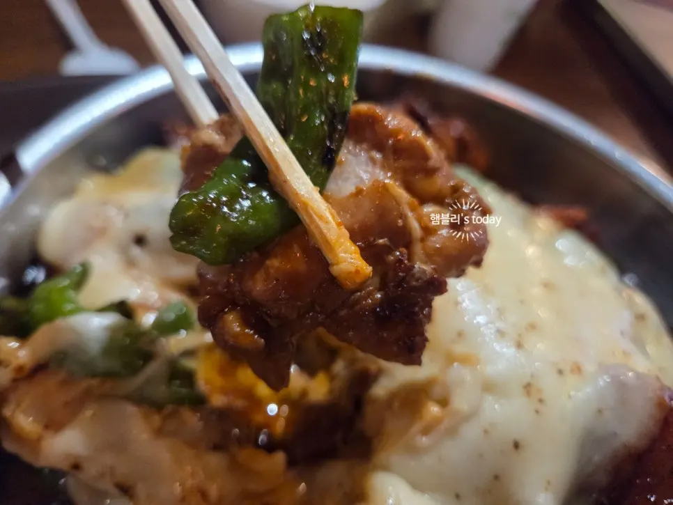 Cheese stretching endlessly from the dish