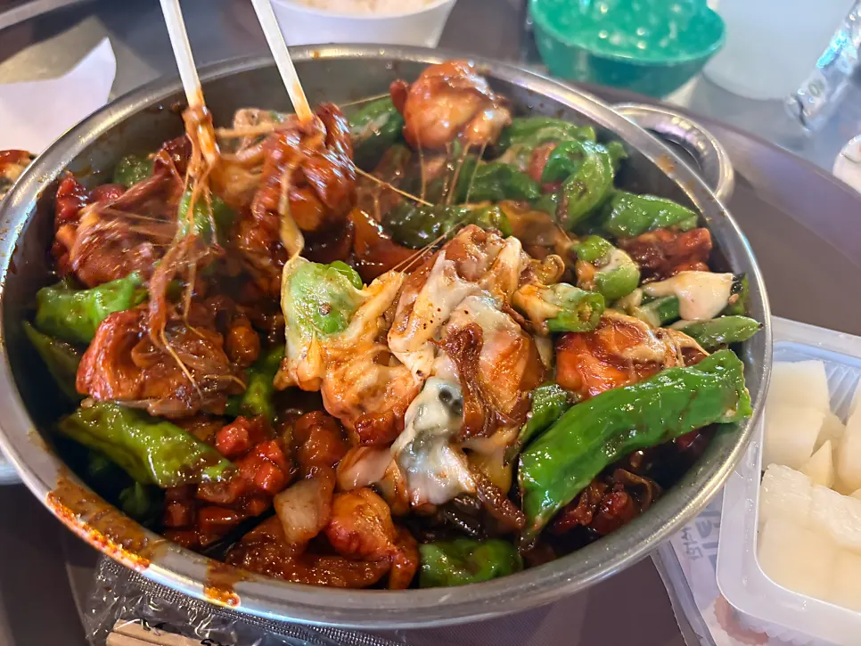 Dakbokkeum and rice set out together at the table