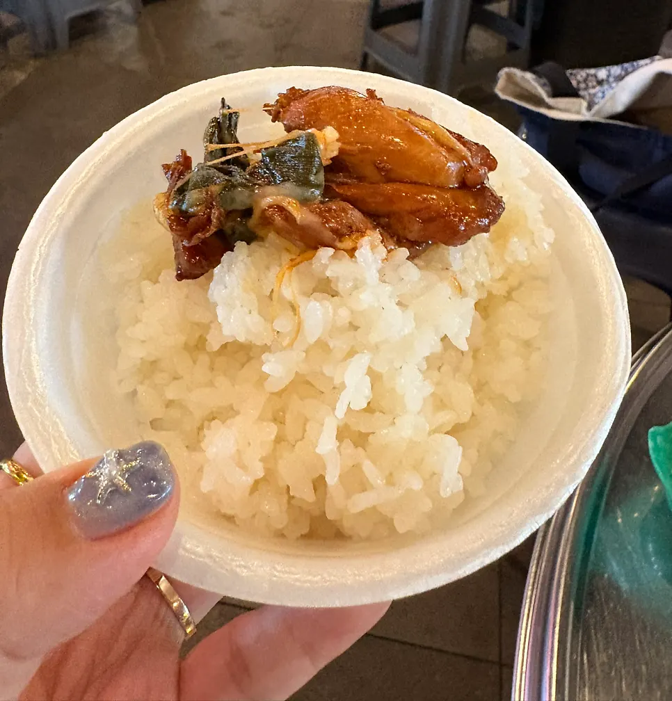A spoonful of rice mixed with the sauce