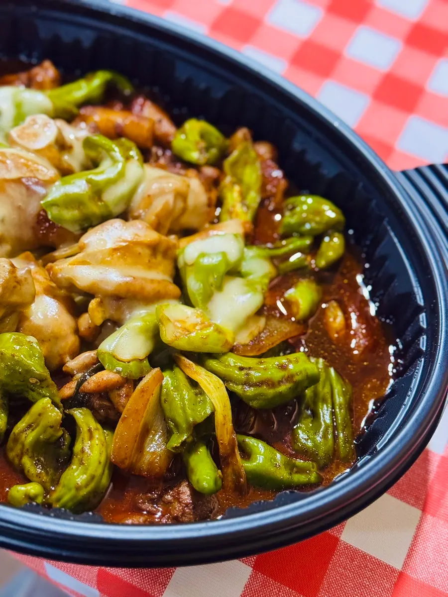 A piece of boneless dakbokkeum with sauce soaked in