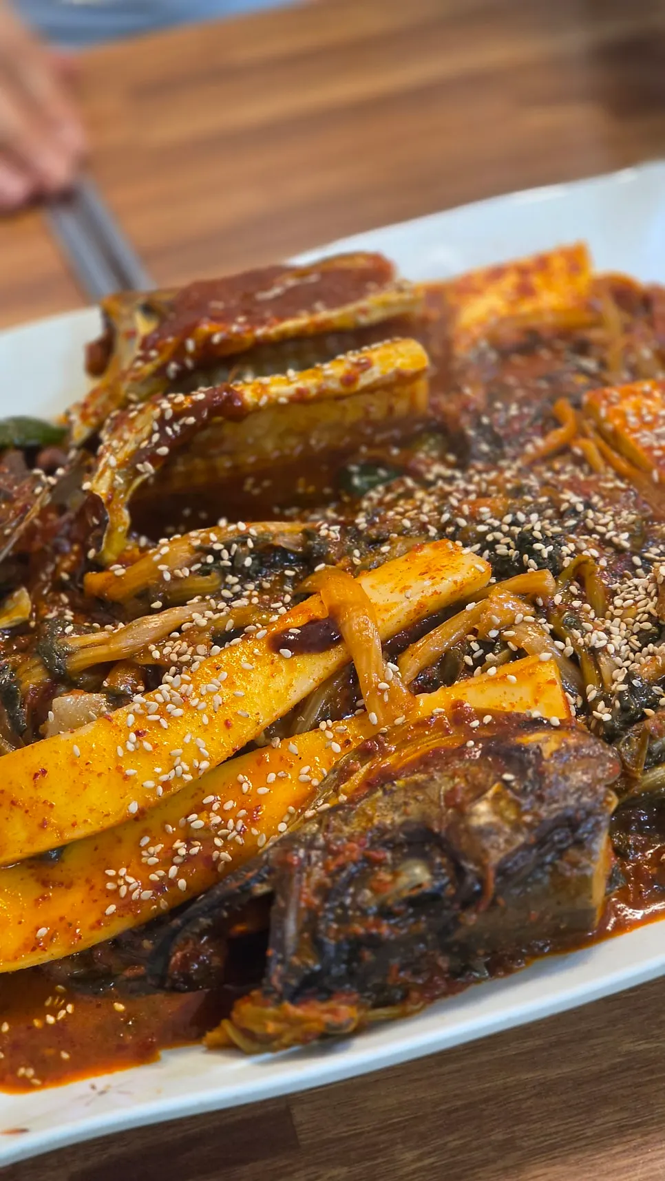 Rice cake inside the braised pollack with radish greens