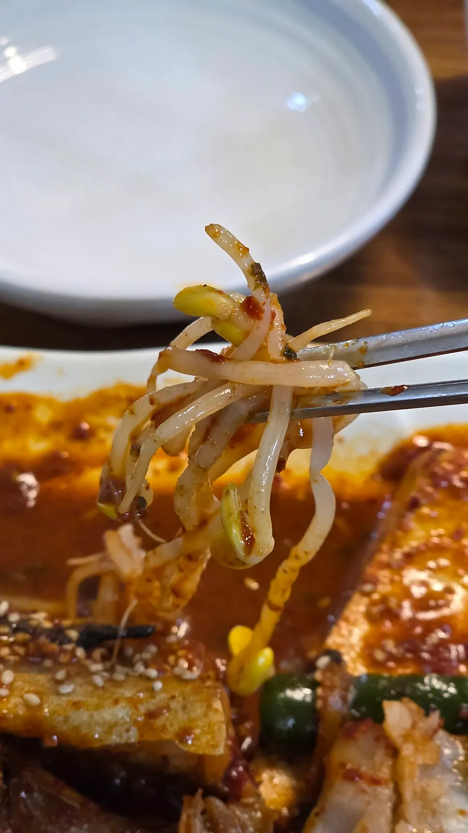 Bean sprouts mixed in sauce with braised pollack